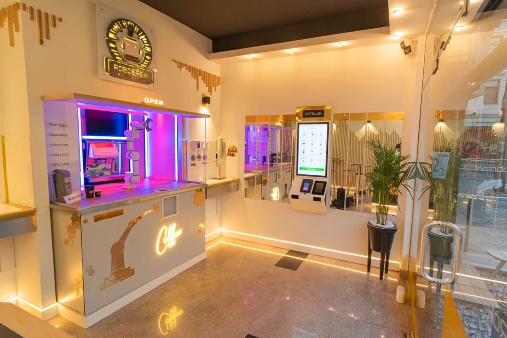 Warmly lit Robobrew interior with signage and service window